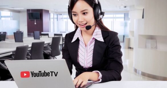 A customer support agent at a desk with a headset and laptop, displaying the YouTube TV logo.