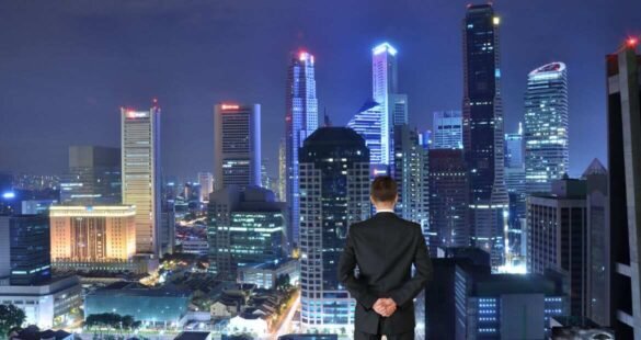 Person on a skyscraper rooftop looking at a futuristic skyline, symbolizing the courage and curiosity behind the phrase Why Not.