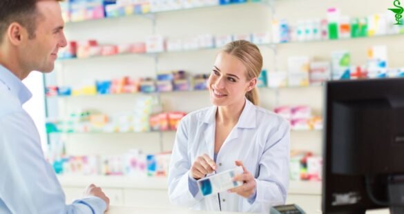 Traveler checking medicine in a European pharmacy where Pepto Bismol is unavailable.